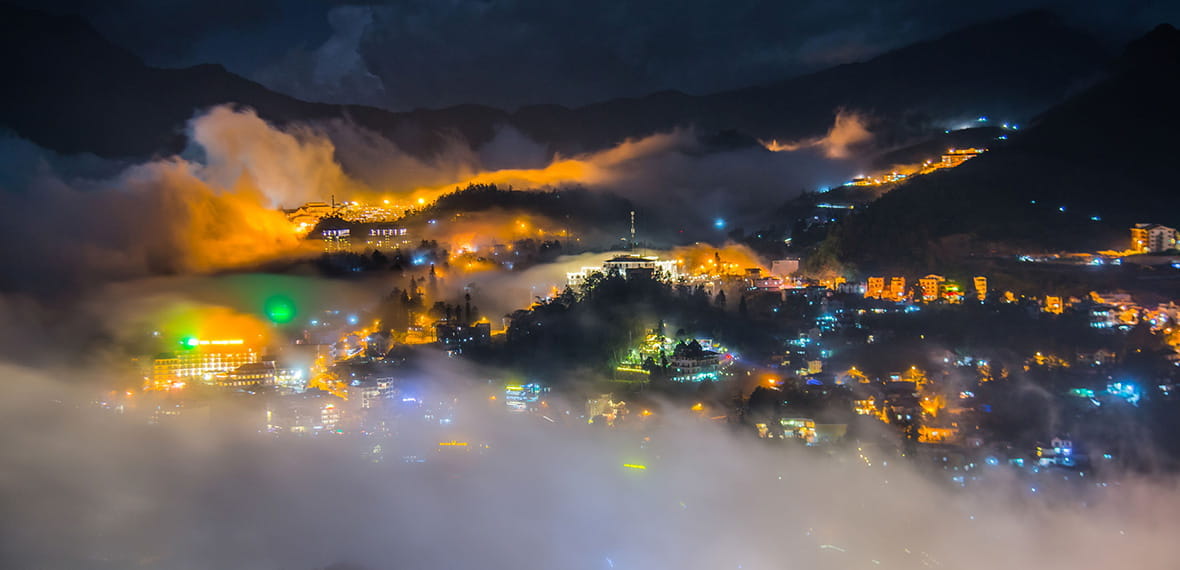 Night Bird View Over a Mountain City