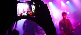 Band playing while a fan is recording