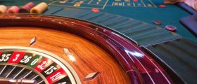 People playing at a roulette table