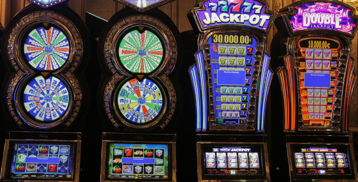 A Row of Several Different Types of Slot Machines 