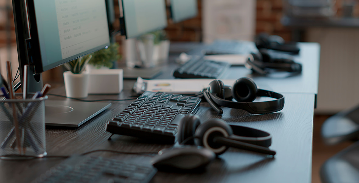 Office Call Center With Headphones and Monitors 