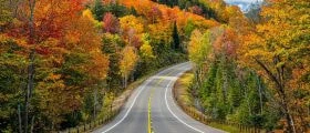 Road in Alberta with mountains in the background