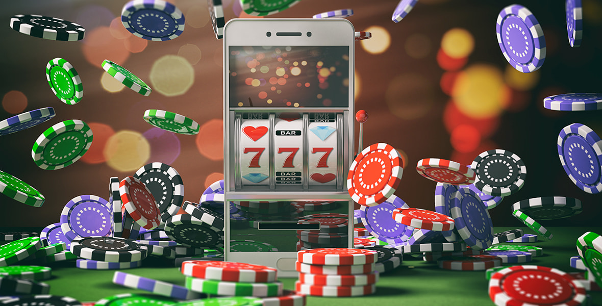 Smartphone with slot game and poker chips 